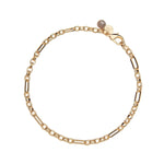 Gold chain necklace with a small round charm