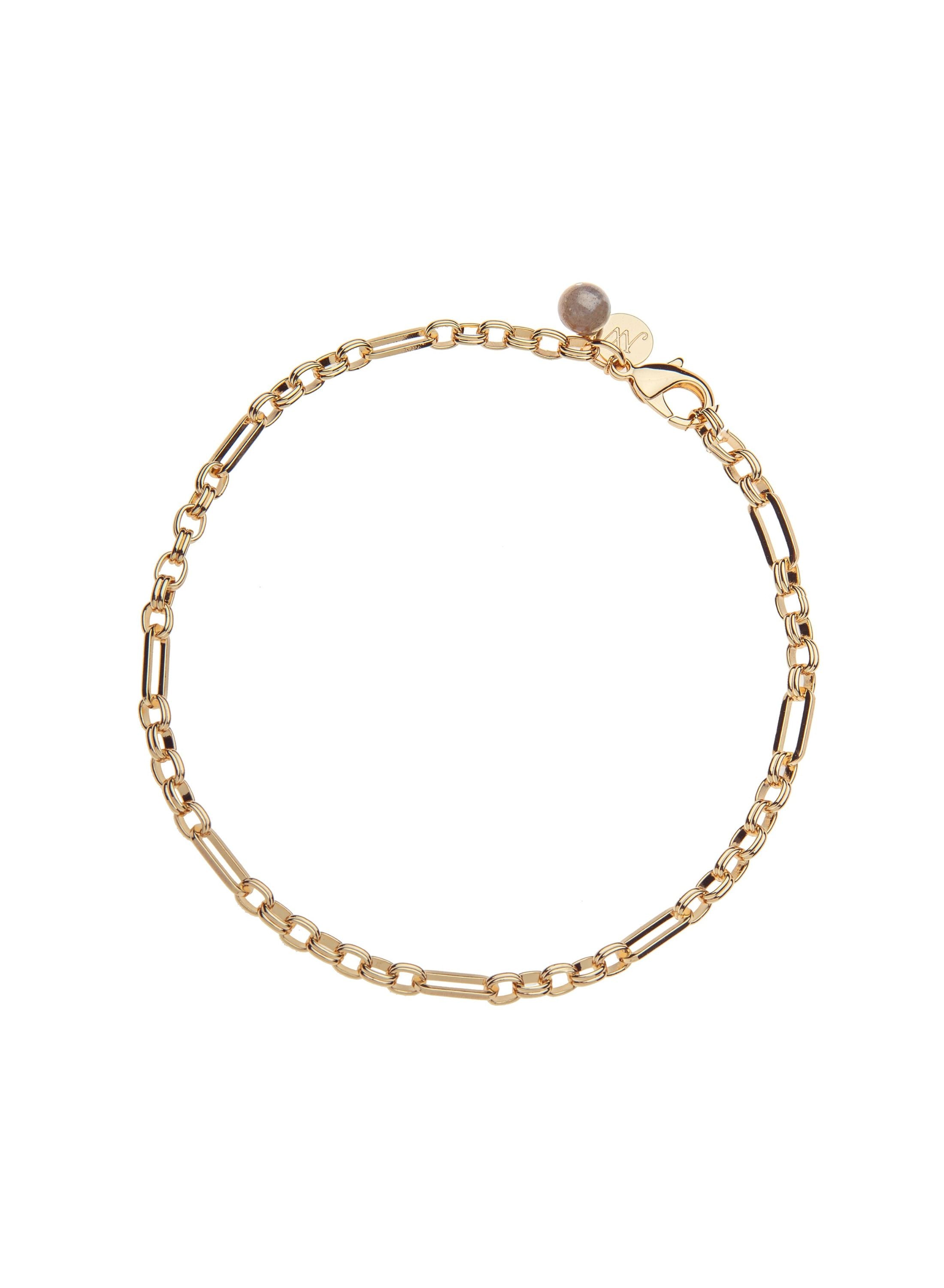 Gold chain necklace with a small round charm