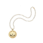 Gold necklace with a round sun pendant