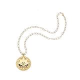 Gold necklace with a round sun pendant